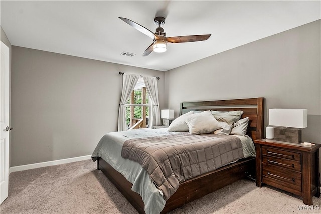 17631 Hayes Rd, Northport, AL 35475 - bedroom with light carpet, baseboards, and ceiling fan