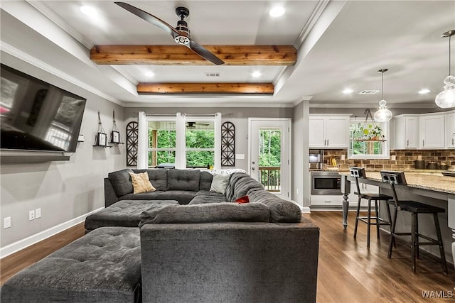 17631 Hayes Rd, Northport, AL 35475 - living room featuring healthy amount of natural light, ceiling fan, crown molding, dark wood finished floors, and recessed lighting
