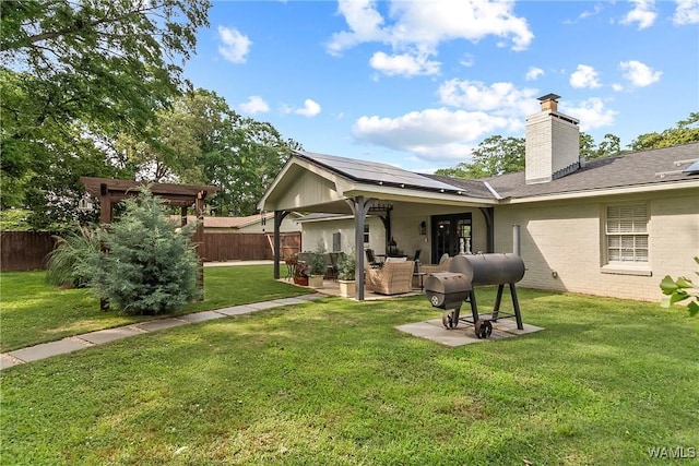 2507 Twin Mnr, Northport, AL 35476 - rear view of property featuring a chimney, a patio, roof with shingles, and outdoor lounge area
