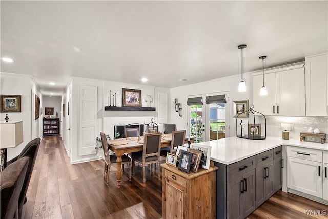 2507 Twin Mnr, Northport, AL 35476 - kitchen with a peninsula, light countertops, white cabinetry, dark wood-type flooring, and recessed lighting