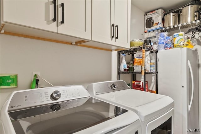 2507 Twin Mnr, Northport, AL 35476 - laundry area with washing machine and clothes dryer and cabinet space