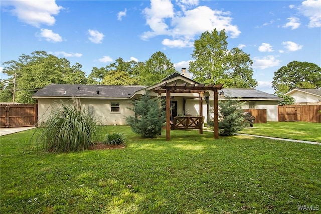 2507 Twin Mnr, Northport, AL 35476 - back of property featuring a pergola, stucco siding, and a chimney