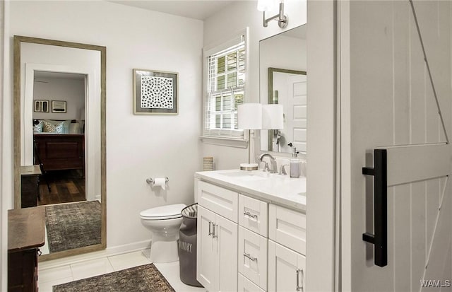 2507 Twin Mnr, Northport, AL 35476 - bathroom with toilet, vanity, tile patterned flooring, and baseboards