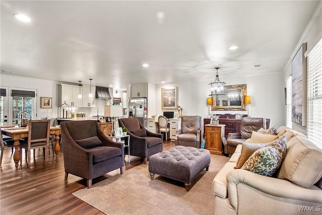 2507 Twin Mnr, Northport, AL 35476 - living area featuring wood finished floors, recessed lighting, a chandelier, and ornamental molding