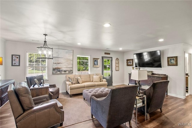 2507 Twin Mnr, Northport, AL 35476 - living area with dark wood finished floors, recessed lighting, a chandelier, ornamental molding, and baseboards