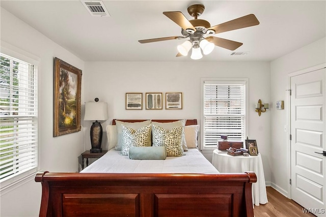 2507 Twin Mnr, Northport, AL 35476 - bedroom with wood finished floors, baseboards, and a ceiling fan