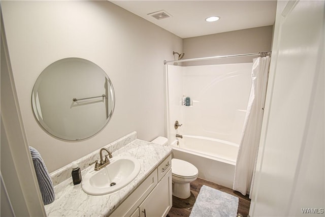 13946 Sullivan Blvd, Northport, AL 35475 - bathroom with vanity, shower / tub combo with curtain, wood finished floors, and recessed lighting