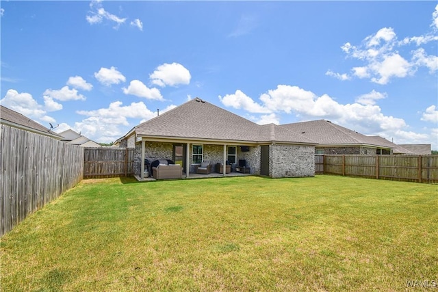 13946 Sullivan Blvd, Northport, AL 35475 - rear view of house featuring an outdoor hangout area, a fenced backyard, a patio, roof with shingles, and brick siding