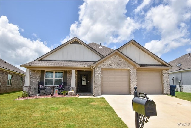 13946 Sullivan Blvd, Northport, AL 35475 - craftsman-style home featuring board and batten siding, a porch, concrete driveway, brick siding, and a garage