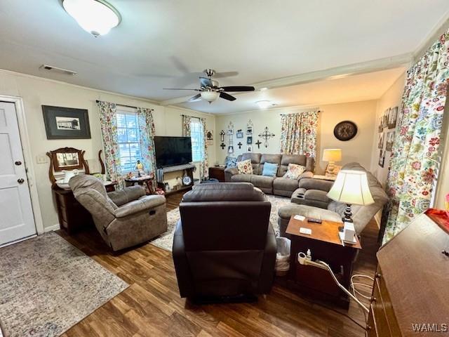 1002 Cedar Crest Dr, Demopolis, AL 36732 - living area with visible vents, a ceiling fan, and wood finished floors