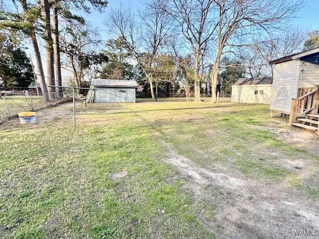 1002 Cedar Crest Dr, Demopolis, AL 36732 - view of yard with a storage shed, an outbuilding, and fence