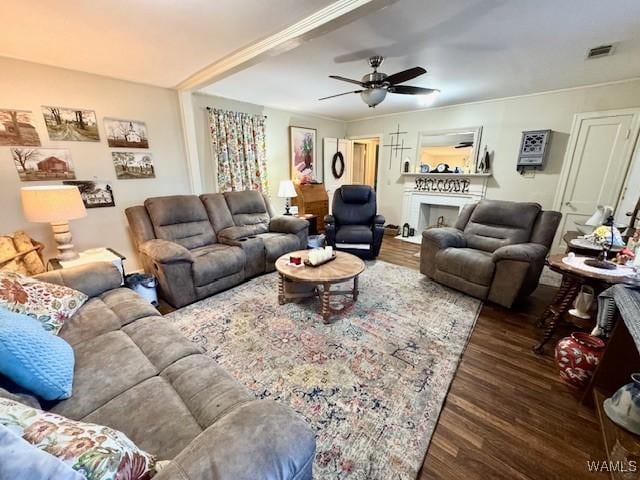 1002 Cedar Crest Dr, Demopolis, AL 36732 - living area with ceiling fan, visible vents, a fireplace, and wood finished floors