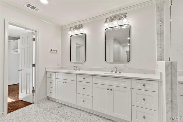 bathroom with vanity and ornamental molding