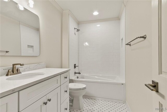 full bathroom with vanity, ornamental molding, tiled shower / bath combo, and toilet