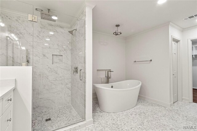 bathroom featuring vanity, crown molding, and shower with separate bathtub