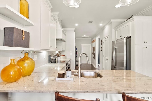 11441 Stella Way, Northport, AL 35475 - kitchen with stainless steel appliances, ornamental molding, recessed lighting, white cabinets, and tasteful backsplash