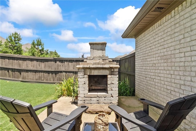 11441 Stella Way, Northport, AL 35475 - view of patio / terrace featuring an outdoor brick fireplace