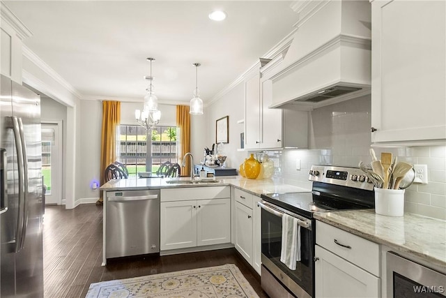 11441 Stella Way, Northport, AL 35475 - kitchen with appliances with stainless steel finishes, a peninsula, custom range hood, a chandelier, and white cabinetry