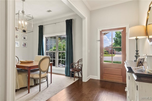 11441 Stella Way, Northport, AL 35475 - entryway featuring a chandelier, dark wood-type flooring, and ornamental molding
