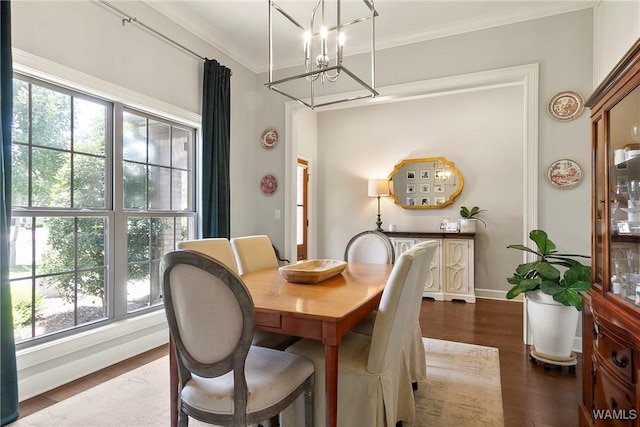 11441 Stella Way, Northport, AL 35475 - dining area with a chandelier, wood finished floors, plenty of natural light, and crown molding