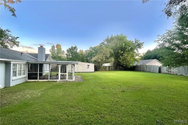 6400 Plantation Ct, Tuscaloosa, AL 35405 - view of yard featuring a sunroom and a fenced backyard