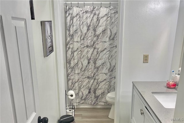 6400 Plantation Ct, Tuscaloosa, AL 35405 - full bathroom with vanity, toilet, and wood finished floors