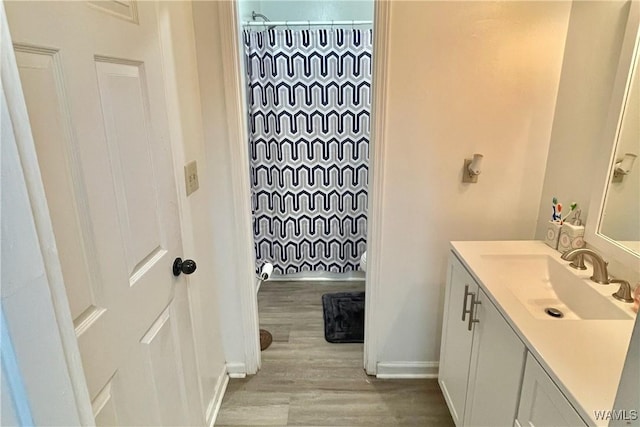 6400 Plantation Ct, Tuscaloosa, AL 35405 - bathroom with a shower with curtain, baseboards, vanity, and wood finished floors
