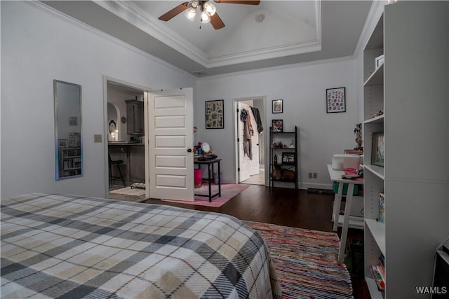 3215 Birch Way, Northport, AL 35475 - bedroom featuring wood finished floors, crown molding, vaulted ceiling, baseboards, and ceiling fan