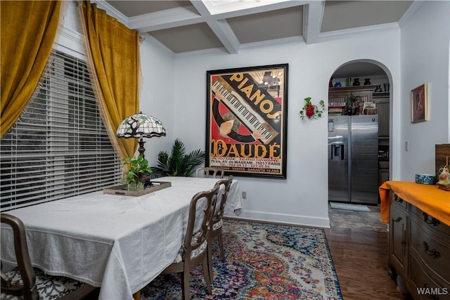 3215 Birch Way, Northport, AL 35475 - dining area with coffered ceiling, arched walkways, beamed ceiling, baseboards, and dark wood-style flooring