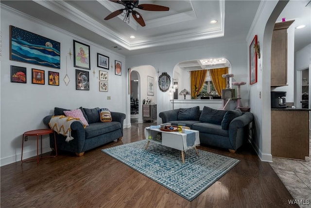 3215 Birch Way, Northport, AL 35475 - living room featuring arched walkways, a ceiling fan, ornamental molding, wood finished floors, and baseboards