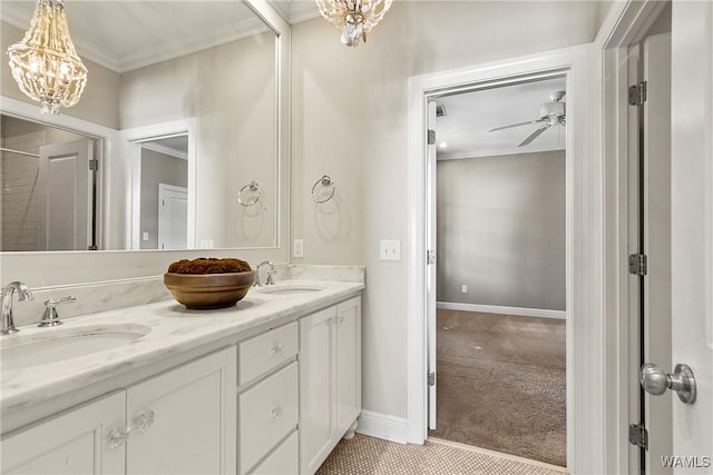 1006 Shady Tree Ln, Tuscaloosa, AL 35406 - bathroom with ceiling fan with notable chandelier, double vanity, a sink, and crown molding