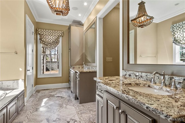 1006 Shady Tree Ln, Tuscaloosa, AL 35406 - full bath featuring a sink, marble finish floor, baseboards, ornamental molding, and an inviting chandelier