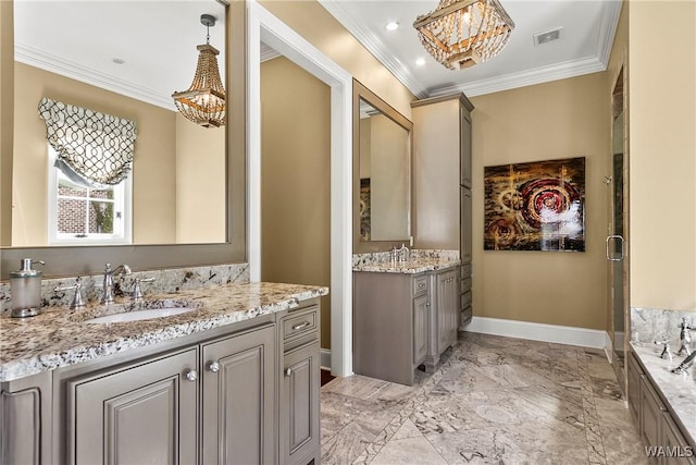 1006 Shady Tree Ln, Tuscaloosa, AL 35406 - bathroom with a notable chandelier, a sink, two vanities, baseboards, and ornamental molding