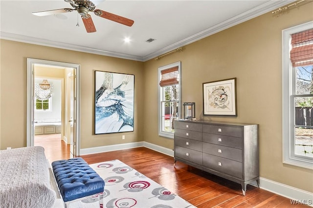 1006 Shady Tree Ln, Tuscaloosa, AL 35406 - bedroom with wood finished floors, crown molding, multiple windows, and visible vents