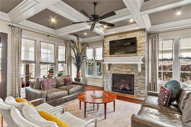 1006 Shady Tree Ln, Tuscaloosa, AL 35406 - living area with a stone fireplace, wood finished floors, beam ceiling, and ceiling fan