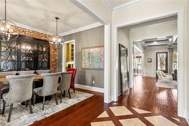 1006 Shady Tree Ln, Tuscaloosa, AL 35406 - dining room featuring an inviting chandelier, baseboards, beamed ceiling, ornamental molding, and hardwood / wood-style floors