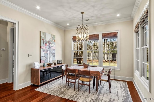 1006 Shady Tree Ln, Tuscaloosa, AL 35406 - dining area featuring dark wood finished floors, baseboards, visible vents, and an inviting chandelier