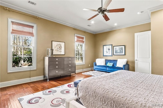 1006 Shady Tree Ln, Tuscaloosa, AL 35406 - bedroom featuring wood-type flooring, baseboards, visible vents, ceiling fan, and ornamental molding