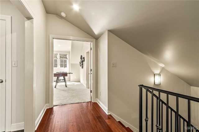 1006 Shady Tree Ln, Tuscaloosa, AL 35406 - corridor with dark wood-style floors, vaulted ceiling, an upstairs landing, and baseboards