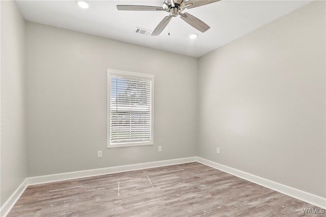 unfurnished room featuring light wood-type flooring and ceiling fan