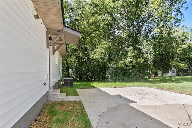 view of yard with a patio area and central AC unit