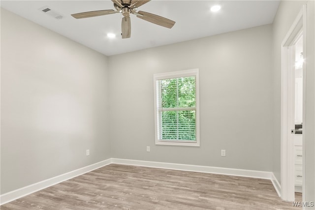 unfurnished room featuring light hardwood / wood-style floors and ceiling fan