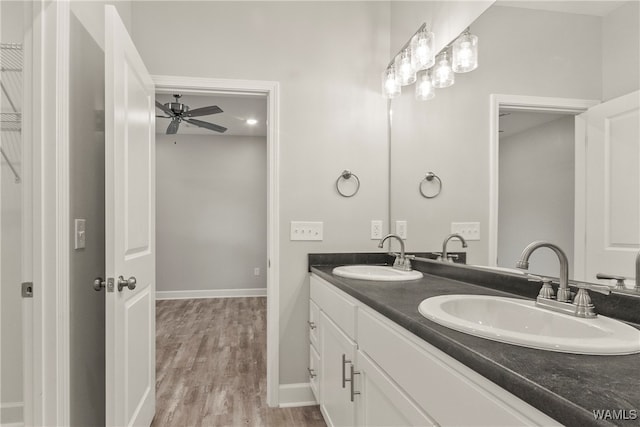 bathroom featuring ceiling fan, vanity, and hardwood / wood-style flooring