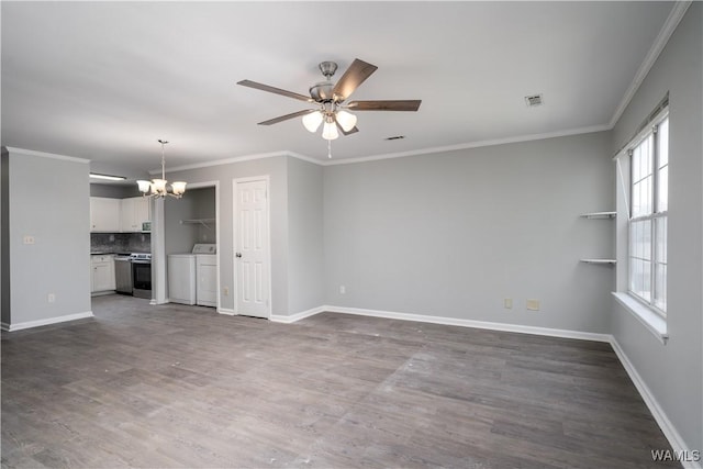 unfurnished living room with dark wood-type flooring, independent washer and dryer, baseboards, and ceiling fan with notable chandelier