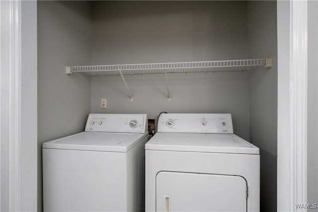 laundry area featuring laundry area and washing machine and clothes dryer