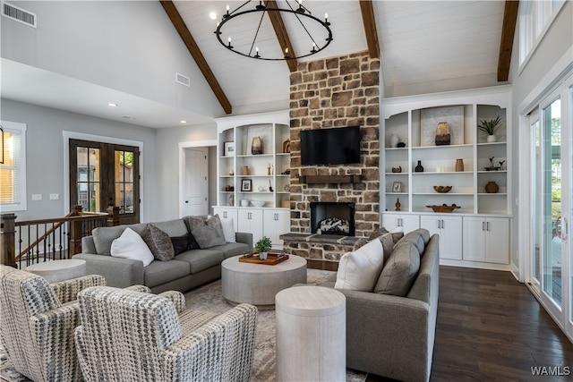 living room featuring french doors, high vaulted ceiling, an inviting chandelier, dark hardwood / wood-style flooring, and a fireplace