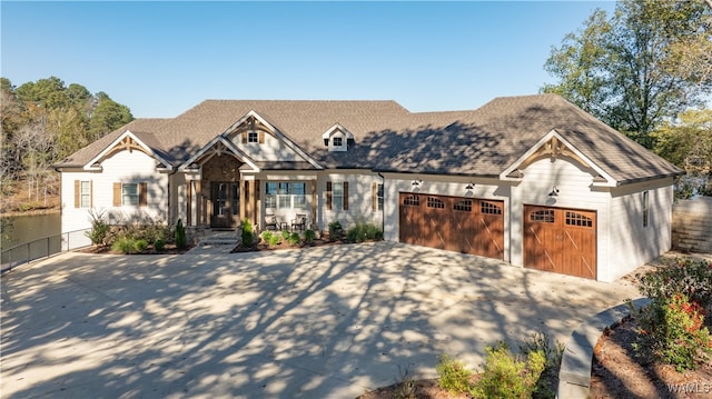 view of front of property featuring a porch and a garage