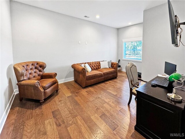 office with light wood-type flooring