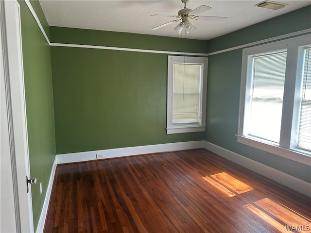 unfurnished room with ceiling fan and hardwood / wood-style floors