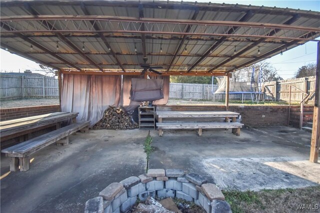 3207 33rd St, Northport, AL 35476 - view of patio / terrace with ceiling fan, a trampoline, and a fenced backyard